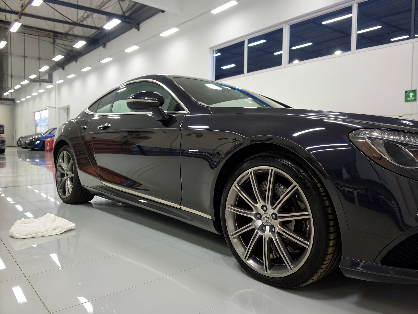 Custom tuned black sports coupe on showroom floor